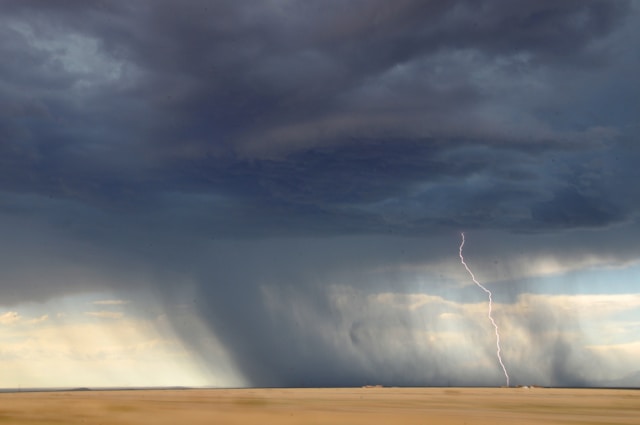 Storm and lightning over field